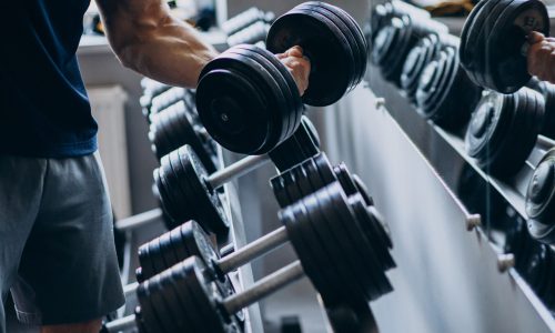 Strong man training in gym
