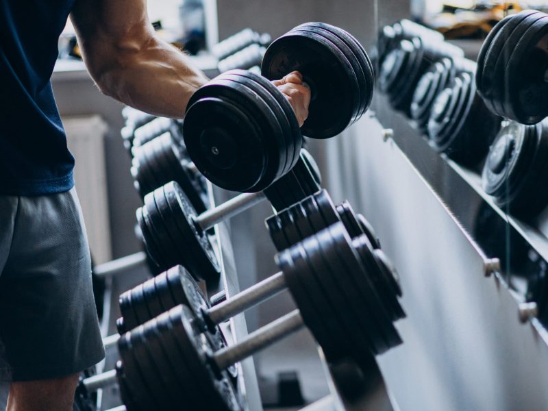 Strong man training in gym